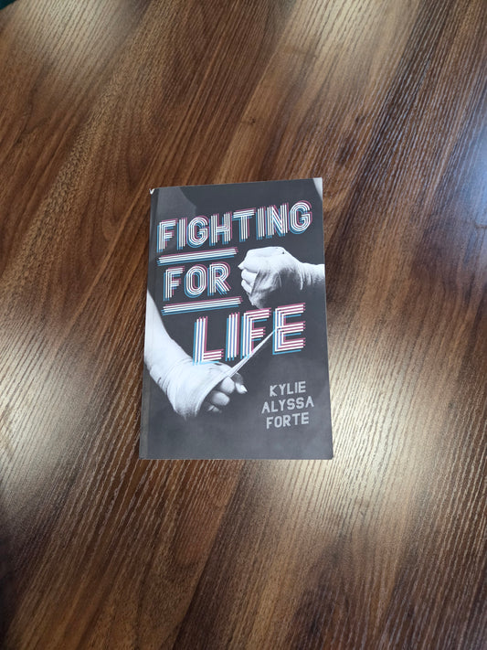 Book titled 'Fighting for Life' by Kylie, Alissa Forte on a wooden surface