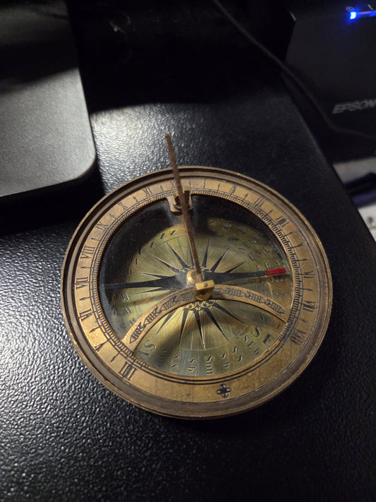 Vintage sun dial compass