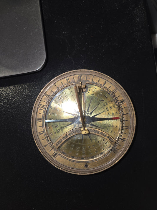 Vintage sun dial compass