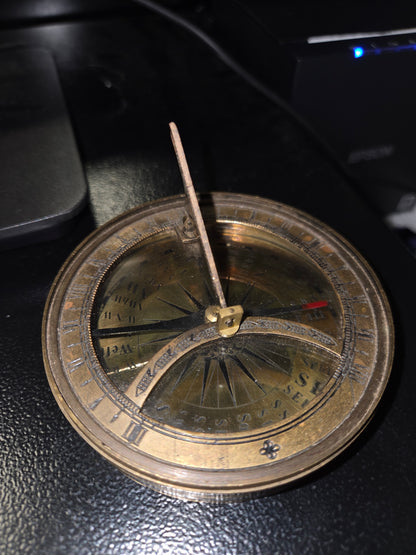Vintage sun dial compass